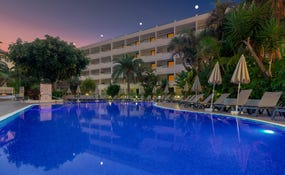 Night view of the hotel and pool